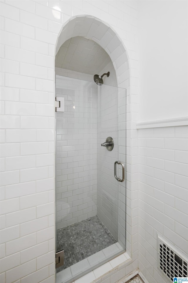 bathroom featuring an enclosed shower