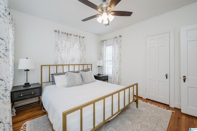 bedroom with hardwood / wood-style floors and ceiling fan