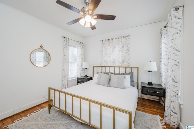 bedroom featuring wood-type flooring and ceiling fan