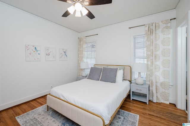 bedroom featuring hardwood / wood-style flooring and ceiling fan