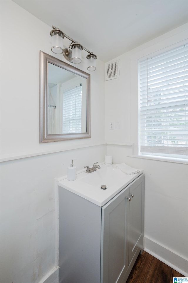 bathroom featuring vanity and hardwood / wood-style flooring