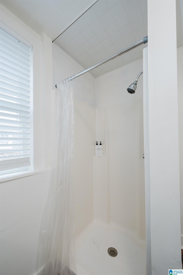 bathroom with curtained shower