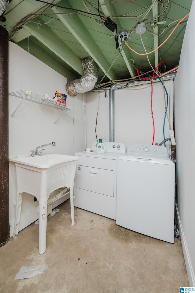 laundry room featuring sink and washing machine and clothes dryer