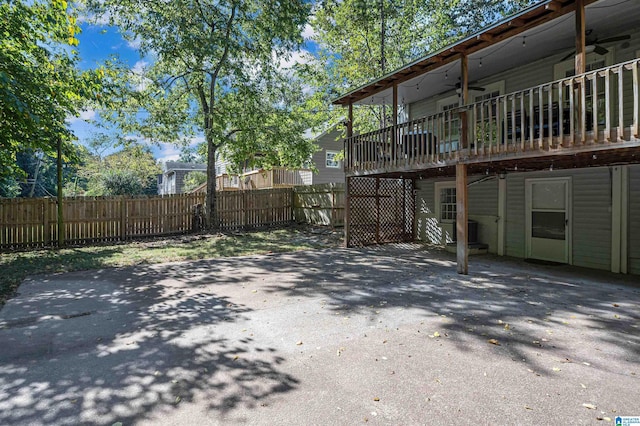 view of yard featuring a patio area and ceiling fan