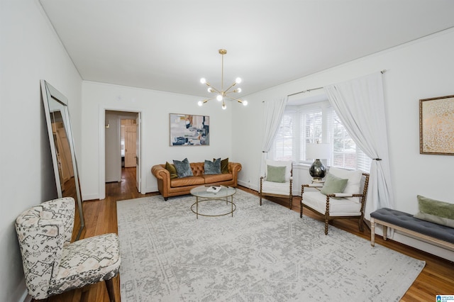 living room with wood-type flooring and an inviting chandelier