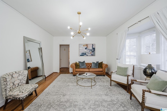 living room with hardwood / wood-style flooring and a notable chandelier