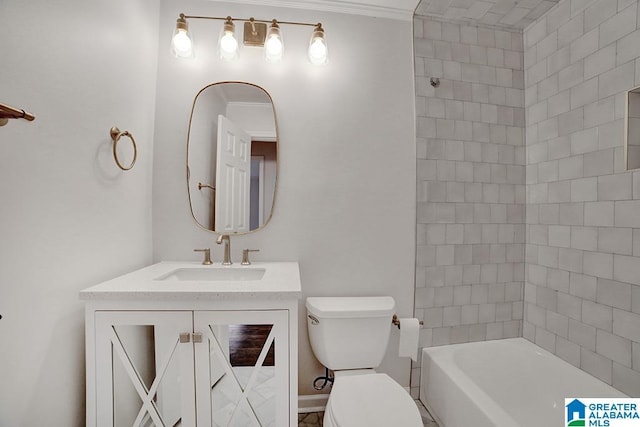 bathroom with crown molding, vanity, and toilet