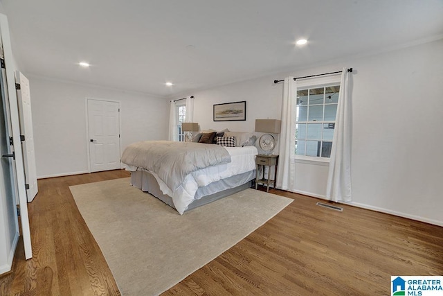 bedroom featuring wood-type flooring