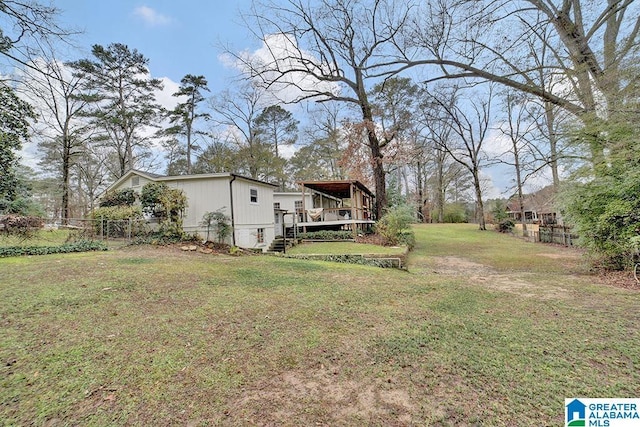 view of yard featuring a wooden deck