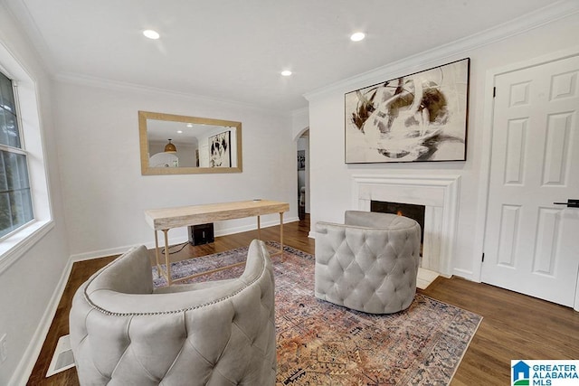 living room featuring ornamental molding and dark wood-type flooring