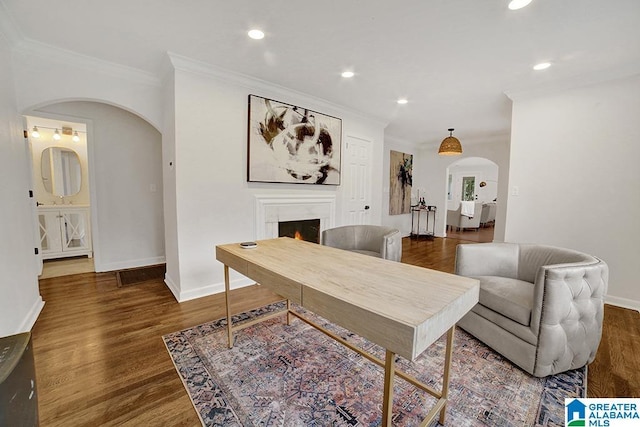 interior space featuring dark wood-type flooring and ornamental molding