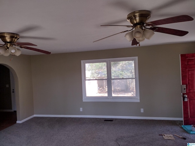 carpeted empty room featuring ceiling fan