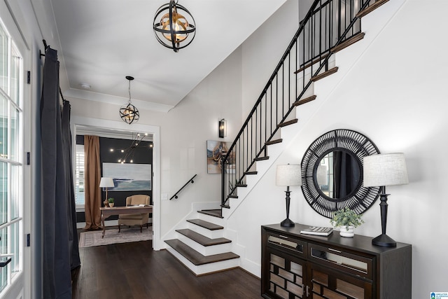 foyer featuring dark hardwood / wood-style flooring and a chandelier