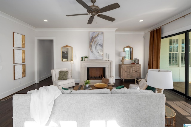 living room with ceiling fan, dark hardwood / wood-style floors, and ornamental molding