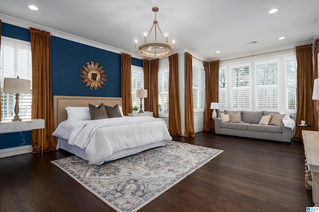 bedroom with a chandelier, dark wood-type flooring, multiple windows, and ornamental molding