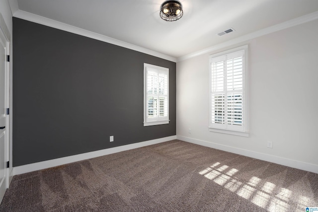 unfurnished room with crown molding and carpet floors