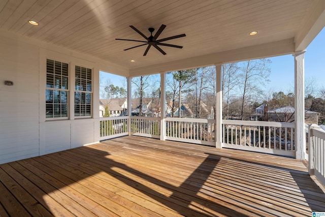 wooden deck featuring ceiling fan