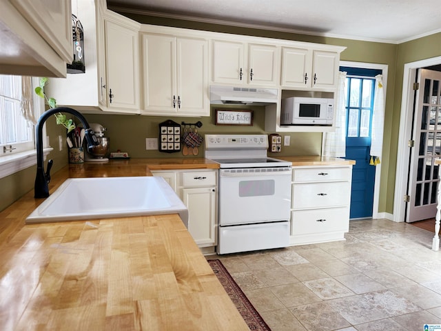 kitchen featuring white cabinets, crown molding, white appliances, and sink