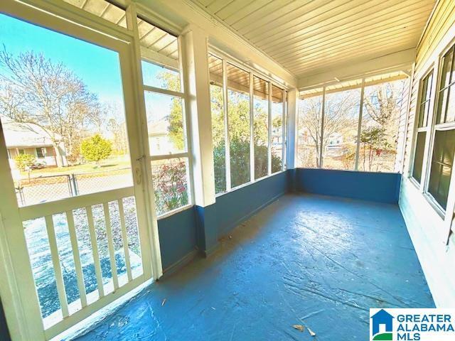 unfurnished sunroom featuring plenty of natural light