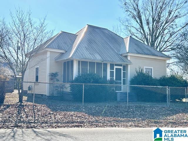 view of front of property with a sunroom