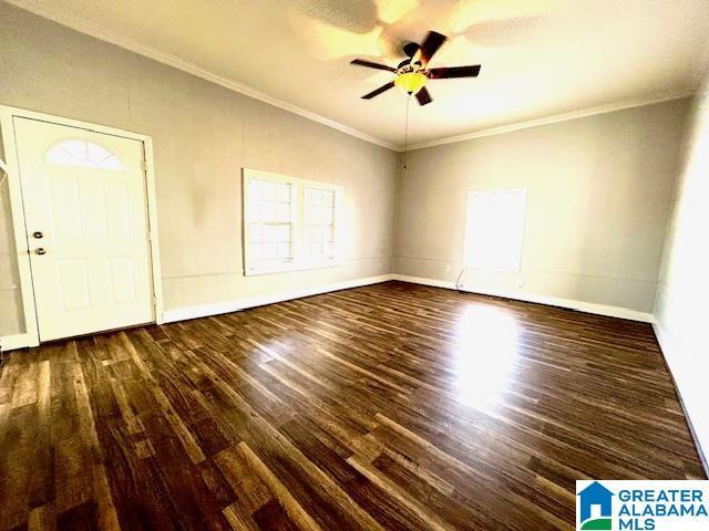 entryway with ceiling fan, dark hardwood / wood-style flooring, and crown molding