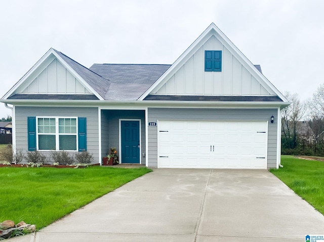 view of front of home with a garage and a front yard