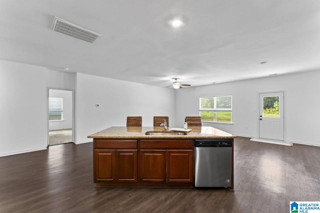 kitchen with a center island with sink, ceiling fan, dark hardwood / wood-style floors, stainless steel dishwasher, and sink