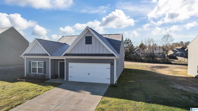 view of front of home featuring a front lawn and a garage