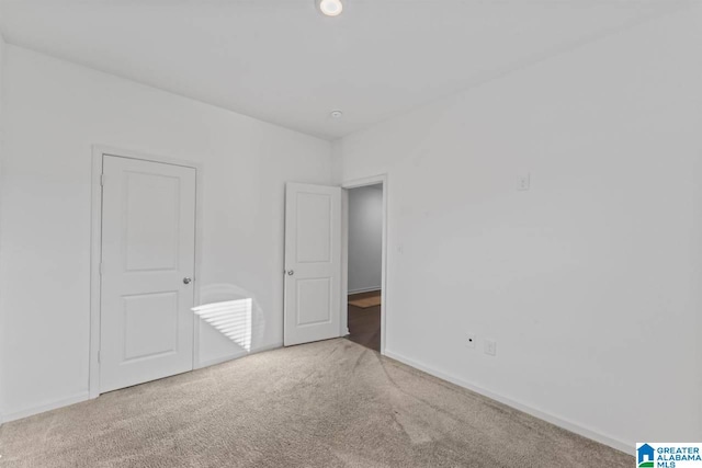 unfurnished bedroom featuring carpet flooring