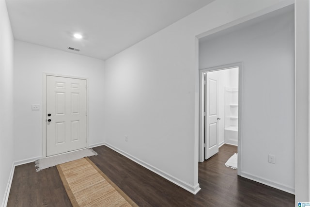 foyer with dark hardwood / wood-style floors