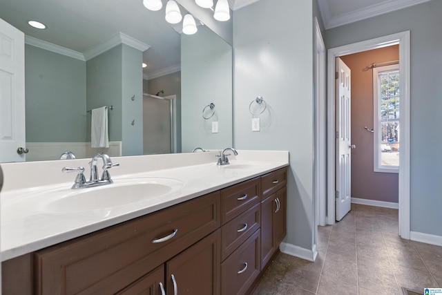 bathroom featuring a shower with shower door, vanity, crown molding, and tile patterned flooring