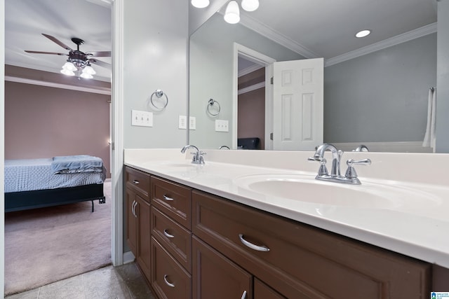 bathroom with ceiling fan, tile patterned flooring, crown molding, and vanity