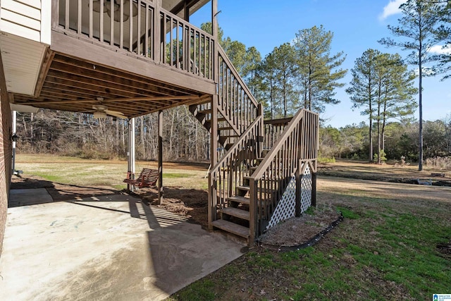 exterior space with ceiling fan and a deck