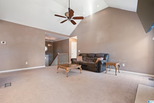 living room featuring carpet, ceiling fan with notable chandelier, and high vaulted ceiling