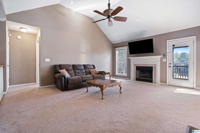 carpeted living room featuring ceiling fan and high vaulted ceiling