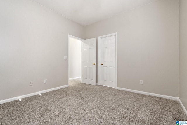 unfurnished bedroom featuring carpet