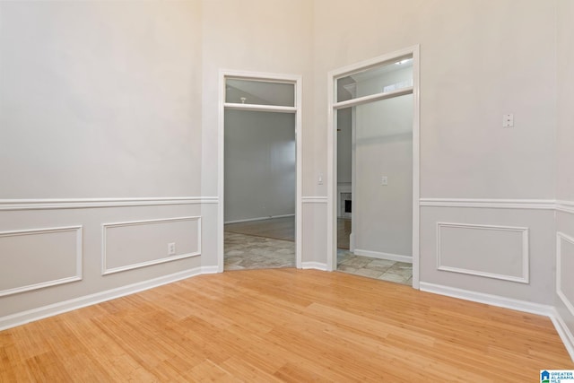 spare room with hardwood / wood-style floors