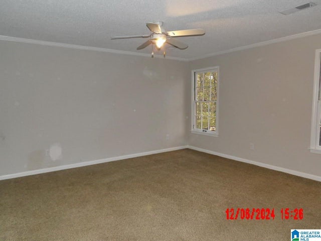 spare room featuring carpet flooring, crown molding, ceiling fan, and a textured ceiling