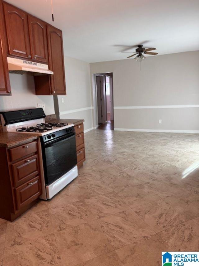 kitchen featuring ceiling fan and white range with gas stovetop