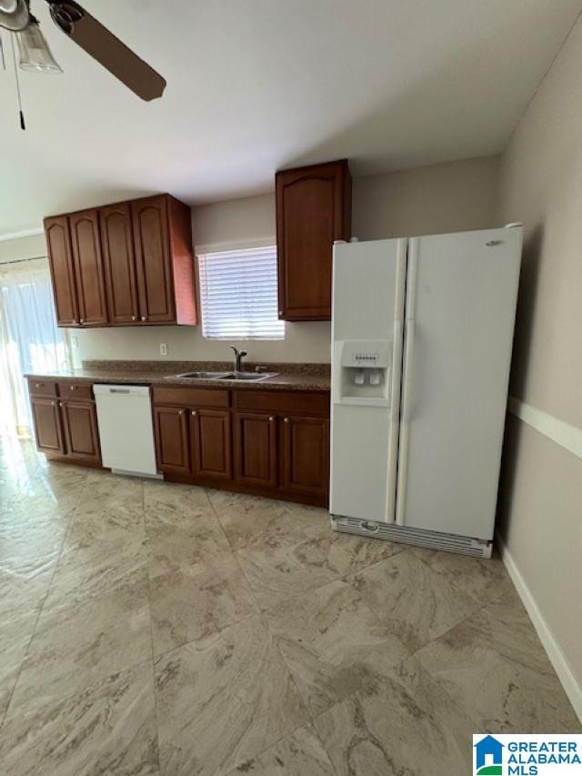 kitchen with ceiling fan, sink, and white appliances