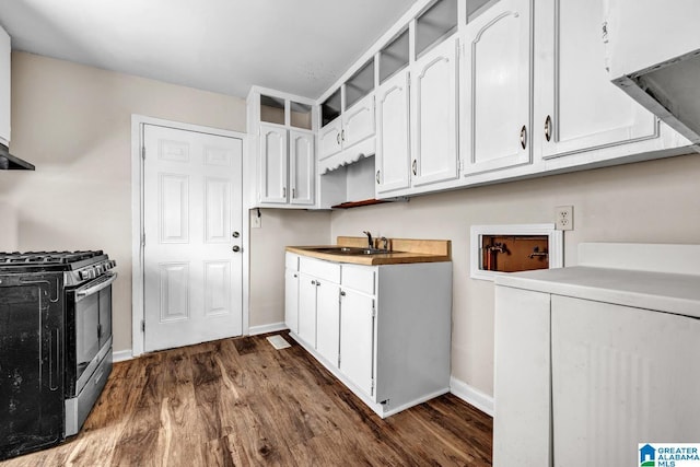 kitchen featuring white cabinets, dark hardwood / wood-style flooring, sink, and stainless steel range with gas stovetop