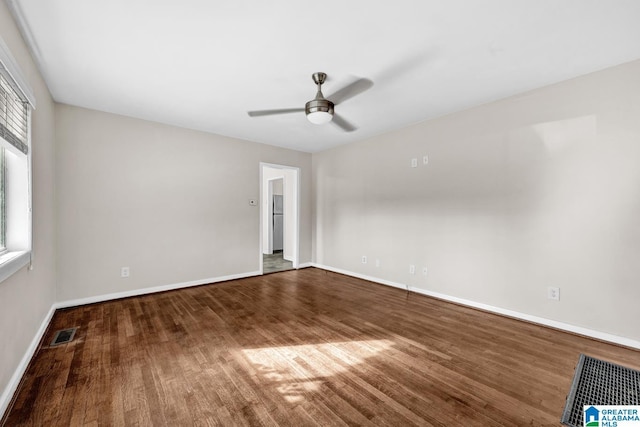 unfurnished room with ceiling fan and wood-type flooring