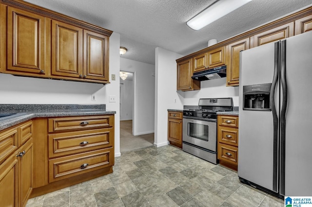 kitchen featuring a textured ceiling and appliances with stainless steel finishes