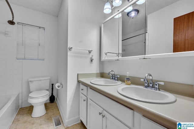 full bathroom with vanity, shower / bathtub combination, toilet, and a textured ceiling