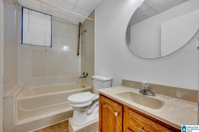 full bathroom with tile patterned floors, vanity, toilet, and tiled shower / bath