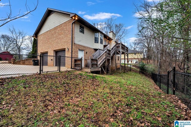 back of property featuring a garage