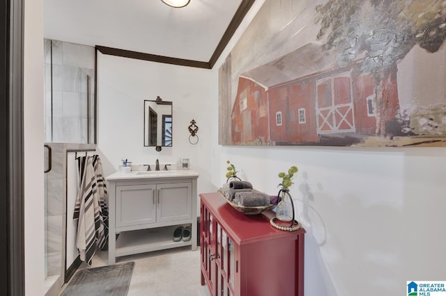 bathroom featuring vanity, an enclosed shower, and crown molding