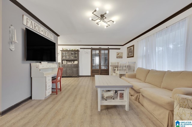 living room with an inviting chandelier and light hardwood / wood-style flooring