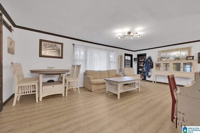 living room with ornamental molding and light wood-type flooring