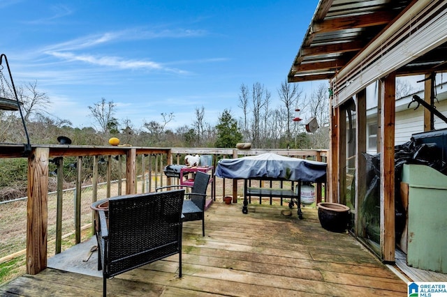 wooden deck with grilling area